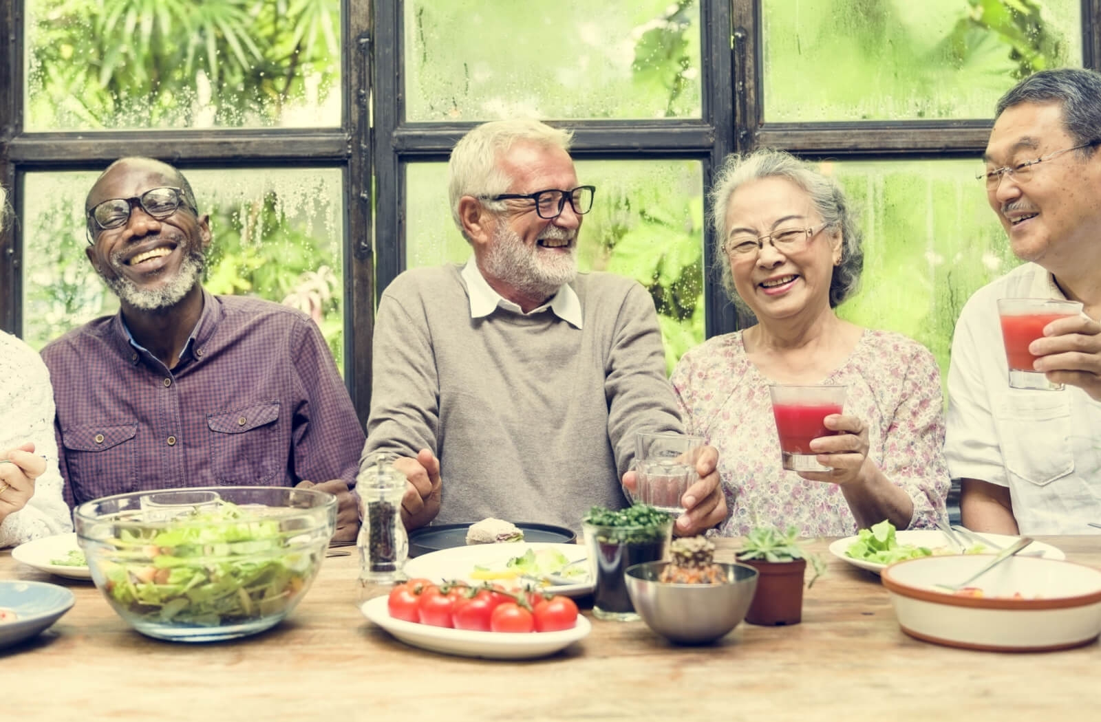 a group of seniors eating a meal together